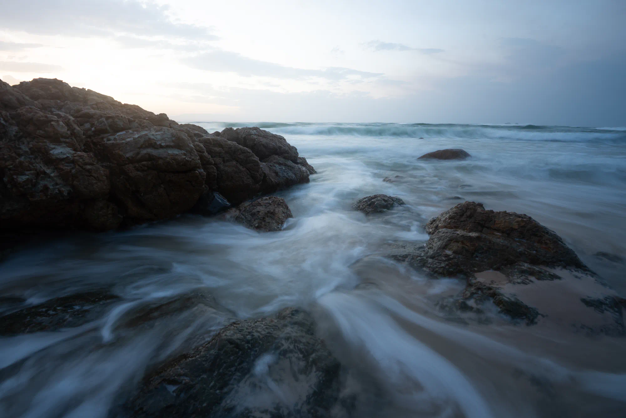 rocks and water flow at sunset, byron